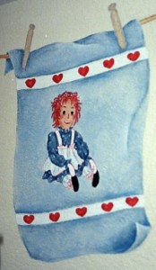 Raggedy Ann painted on a hand towel