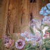 Photo of hand painted flowers on floor.
