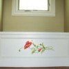 Photo of poppies painted on a window seat.