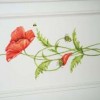 Red poppies painted on a window seat.